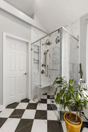 Black and white bathroom with checkered tile floors