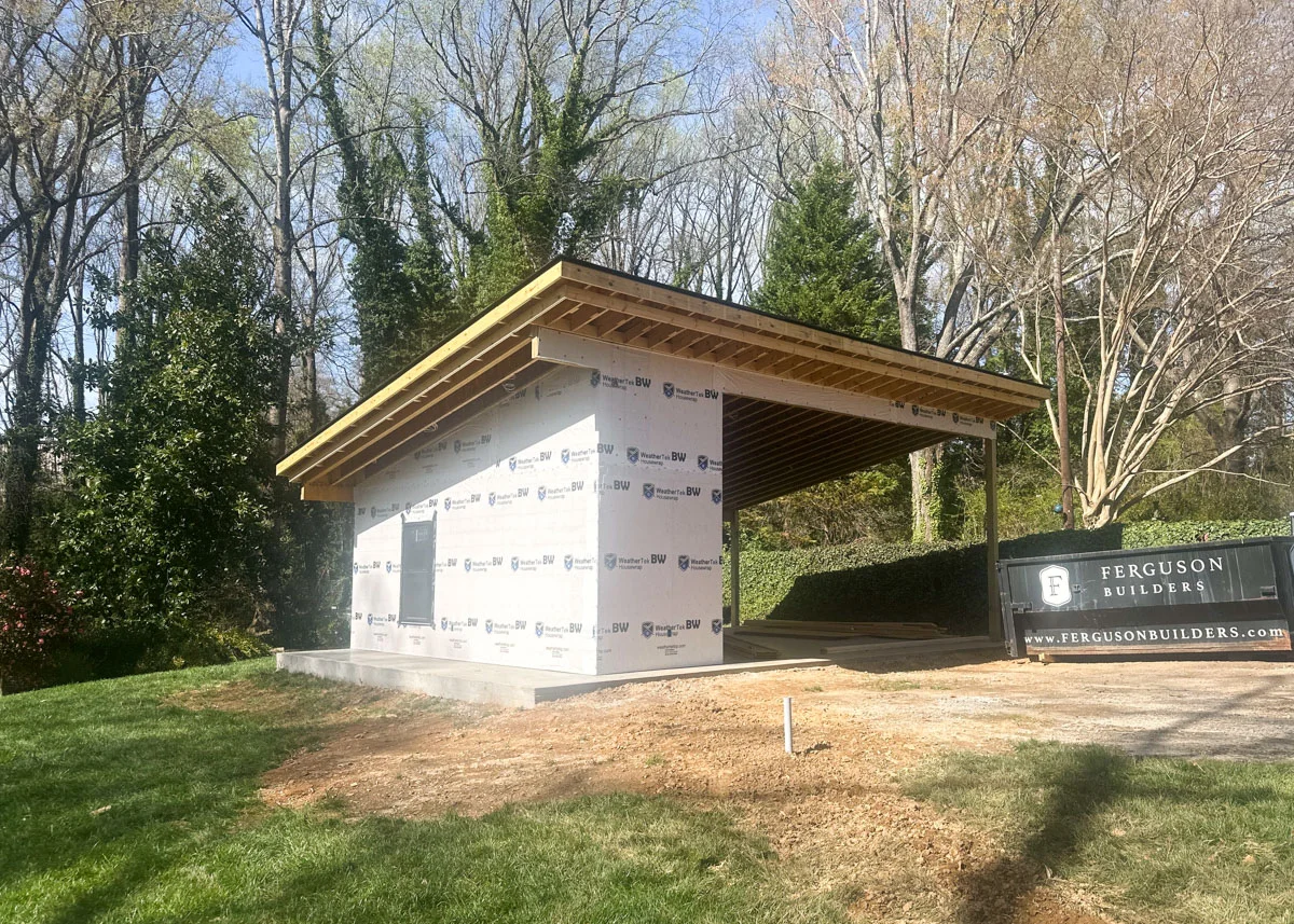 Custom carport in process, with framing and waterproofing completed